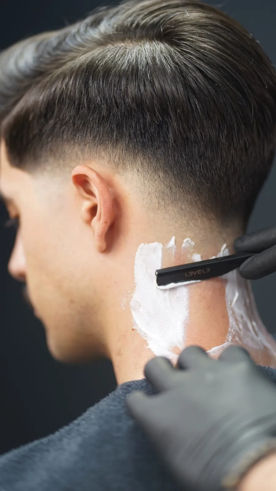 Straight-razor neck shave on a skin fade