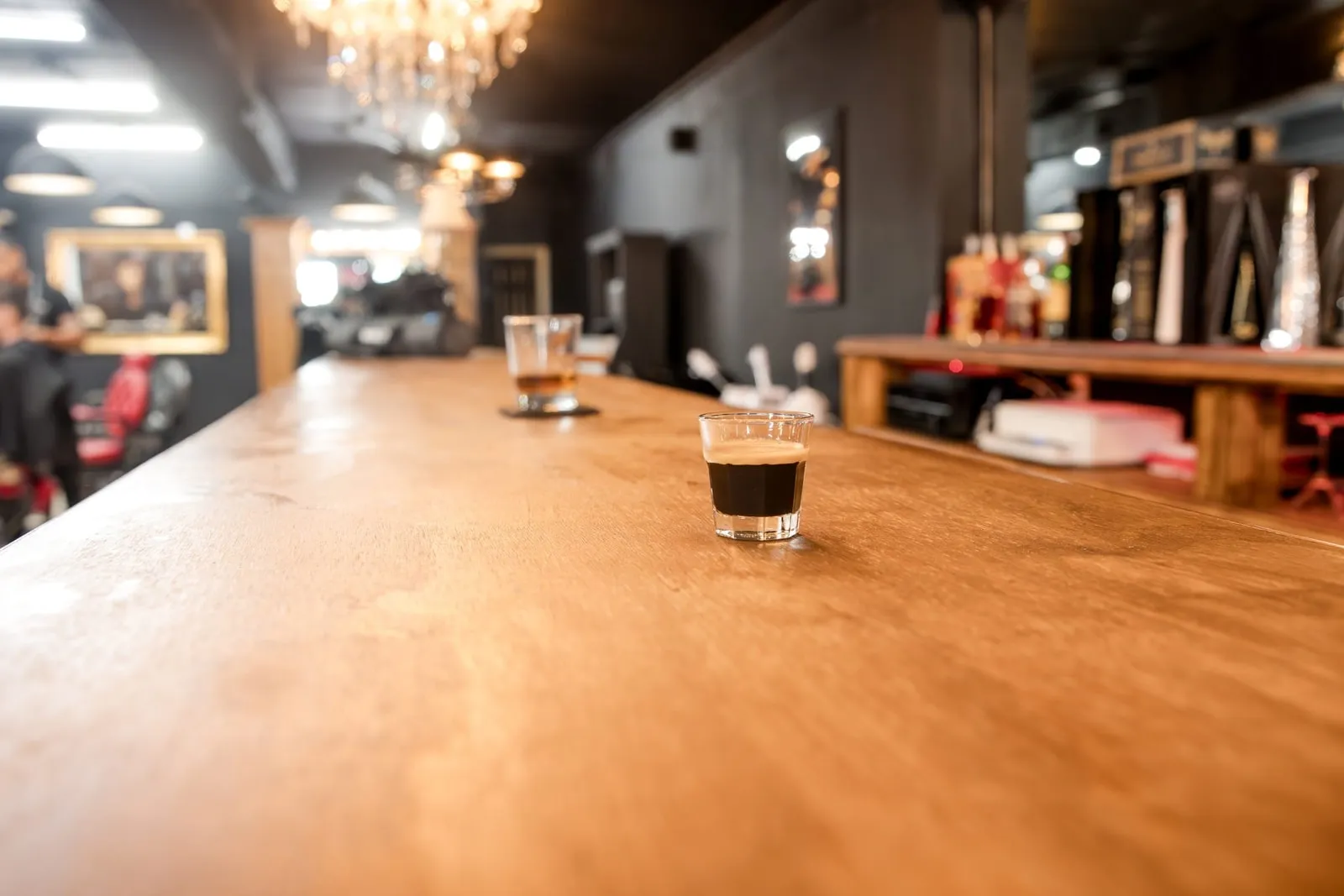 Espresso on the long wood bar inside the shop