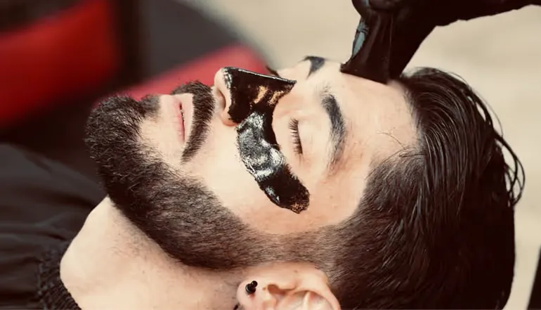 Black mask facial treatment