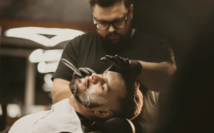 Client receiving the full Barber & Co haircut and shave package